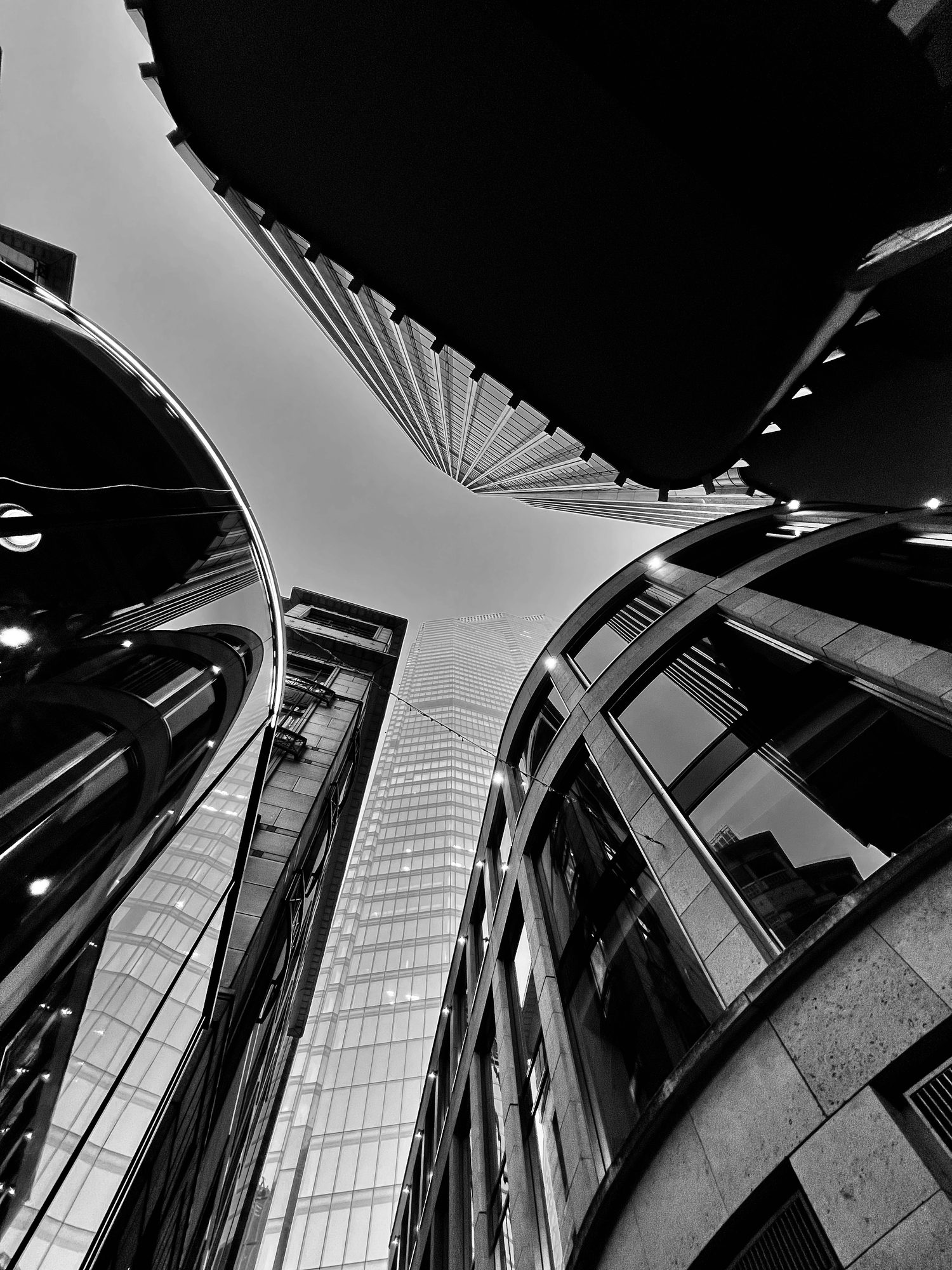 Looking up through London commercial architecture in glass and stone